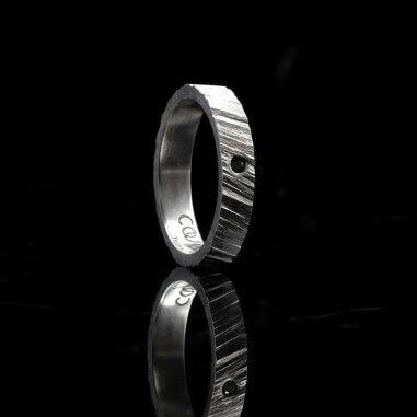 Men's wedding ring with black diamond...