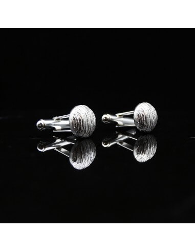 Boutons de manchettes en argent...